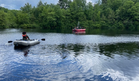 The UB Paleoclimate Dynamics team doing field work while in boats at Red Pond. 