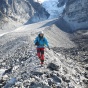 A student walking on a mountain ridge. 