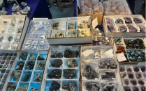 Rocks are displayed on a table for sale. 