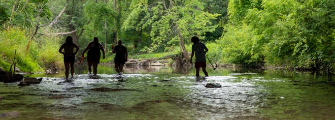 Students in a canoe and kayak on Lake LaSalle collecting water samples. 