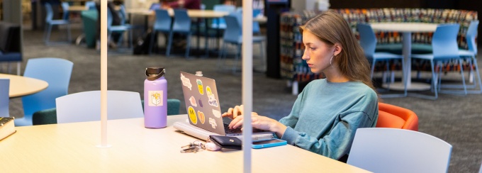 Student at the library studying. 