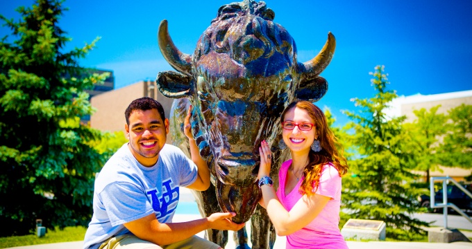 Students with Buffalo statue, North Campus. 