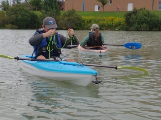 Zoom image: EVS 452/552 Limnology students collecting water quality samples in Lake LaSalle, University at Buffalo. 