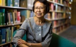 Zoom image: Jessie Poon, in the department of geography, is photographed in Lockwood Library in June 2024. Photographer: Douglas Levere
