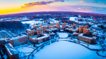 Zoom image: A winter aerial view of North Campus looking over Lake LaSalle.