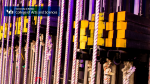 Zoom image: A closeup of ropes and equipment back stage of the theatre with the College of Arts and Sciences logo.