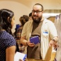 A student in the Department of Biological Sciences, presents at the summer research poster session. 