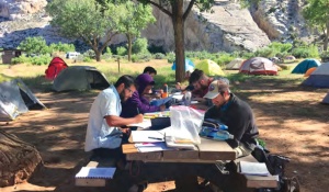 Field camp students working on maps at Split Mountain campground, Utah. 