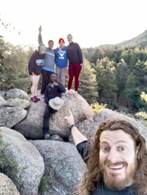 Zoom image: Students Jane Halfhill, Mareli Paredes, Rachel Bakowski, Kiersten Hottendorf, Albert Kyambikwa, and Travis Parsons (inescapable foreground figure) at our campground in the Hualapais Mountains, western Arizona.  Photo by: Travis Parsons. 