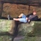 Antonio Manzella lounging on huge rectangular boulders. 