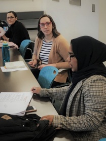 Graduate students in a classroom. 