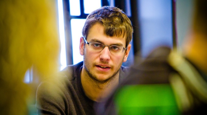 Student asking question in classroom.