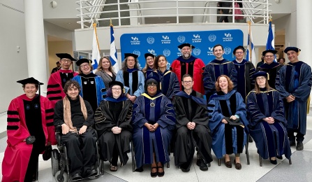 Faculty dressed in regalia before commencement. 