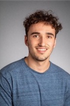 Joseph Romagnolo, receiver of 2020 Outstanding Senior. Grey backdrop. 