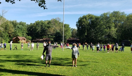 Photo of Jon O’Brien (left) running a 2021 Summer Camp. 