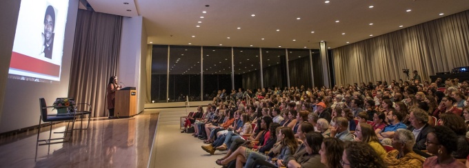 Photo of audience at Angie Thomas talk for the 2018 Buffalo Humanities Festival in the auditorium of the AKG Museum. 