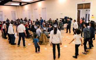 Zoom image: social dance in a large room.