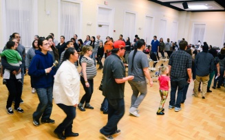 Zoom image: social dance in a large room.