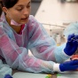 Students exploring dental skills at the 7th Generation Operation. 