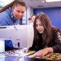 Shquanebin Lone teaches students how to make ribbon bags. 