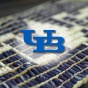 Hiawatha Wampum belt with UB logo in front of it. 