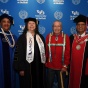 A SUNY administrator (left), Agnes Williams (second from left), Oren Lyons (second from right), and President Satish K. Tripathi (right). 