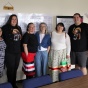 Six individuals standing in front of a wall for a Haudenosaunee archive resource and knowledge portal team photo. 