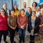 Group photo of thirteen people from the Department of Indigenous Studies. 