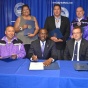 Seneca Nation representatives and Mayor Byron Brown (center, seated) signing a legal document. 
