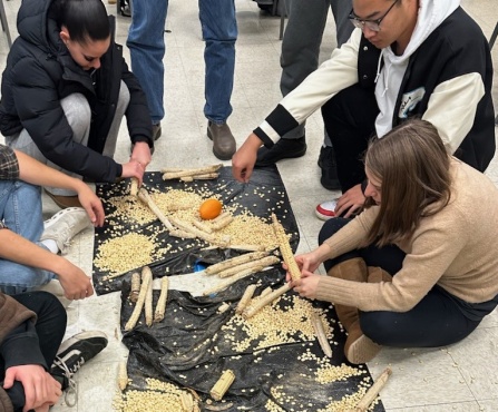 Mia McKie teaching traditional food processes. 