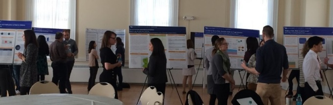 Students at a poster presentation. 