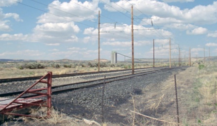 Plains landscape with railroad tracks. 