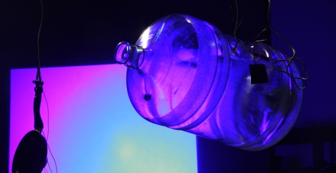 Color projection through water jug. 