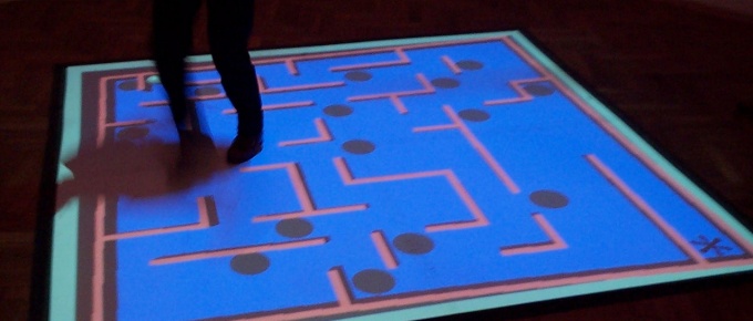 Interactive game projected on the floor.