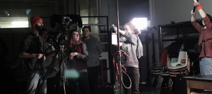 Students setting up a film shoot. 