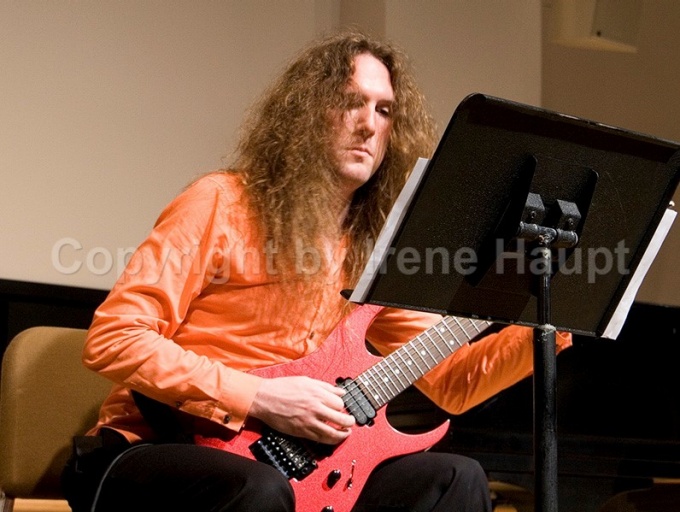 Zane Merrit playing electric guitar. 