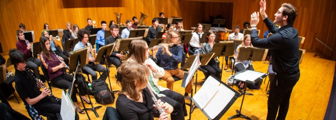 A dress rehearsal on the stage in Slee Hall. 