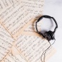 Sheet music and headphones. 