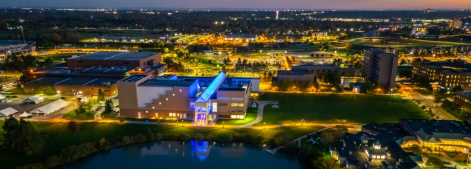 The skylights of the Center for the Arts are illuminated in blue . 