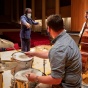 Michael Mwenso points to a student drummer during a class. Photo: Meredith Forrest Kulwicki. 