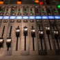 Fader digital mixing console with volume meter. 