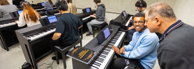 Students participate in the piano lab led by Michael Serio, a keyboard instructor in the department of music, in Baird Hall in March 2024. Photographer: Douglas Levere. 