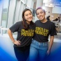 Two UB students wearing 'Pencils of Promise' shirts. 