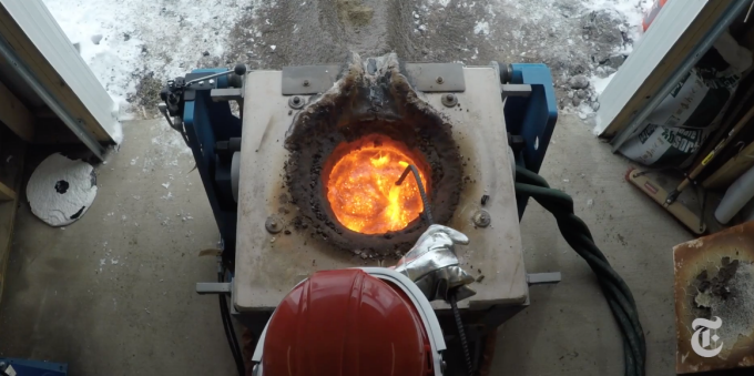 A researcher mixes molten lava. 