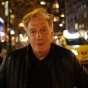 Alan Zweibel pictured in an urban evening setting. 