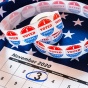 Concept of the 2020 presidential election featuring the American flag, a calendar with Nov. 3rd circled and "I Voted Today" stickers. 