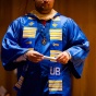 A graduate crosses the stage during aa ALANA ceremony. 