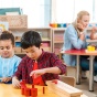 Children playing in a pre-K classroom. 