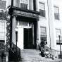 Students sit on the steps in front of Foster Hall in a photo from 1945. 