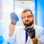 Petar Pajic, UB PhD student in biological sciences, prepares a saliva sample for separation and analysis. 